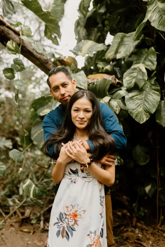 Couple embracing in a botanical setting